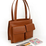 Carry all office essentials in cruelty free Barbara women office tote bag firepit lifestyle 1